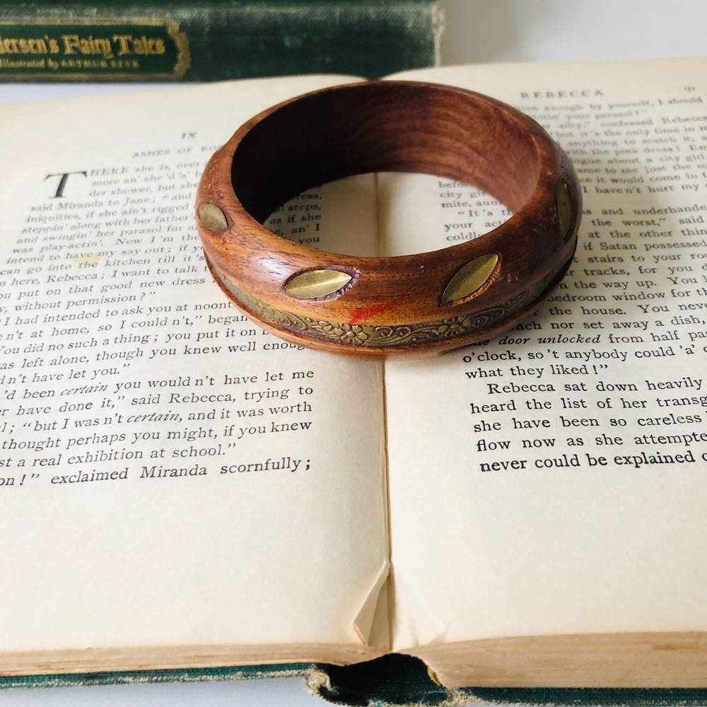 Wooden bangle bracelet with metal flower detail
